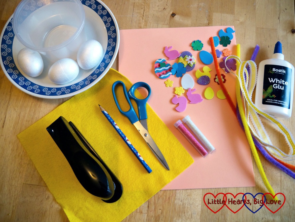 The items you will need: two small bowls, polystyrene eggs, a plate, craft foam, felt, stapler, scissors, glitter, glue, pencil, foam shapes or stickers to decorate