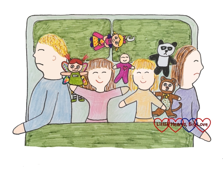 A drawing of me, hubby and the girls asleep in bed with an army of toys joining us too