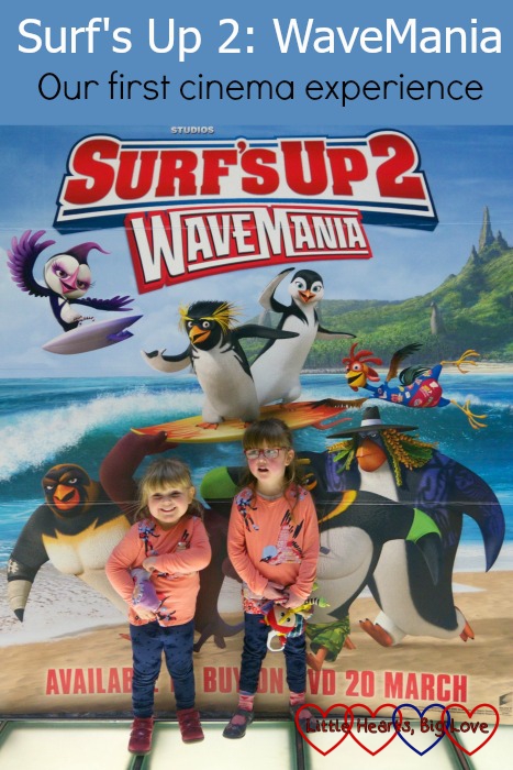 Jessica and Sophie standing in front of the Surf's Up 2: WaveMania poster. "Surf's Up 2: WaveMania - our first cinema experience"