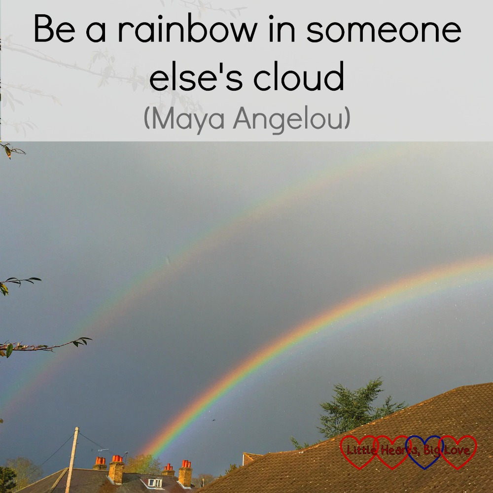 A picture of a double rainbow with the quote "Be a rainbow in someone else's cloud - Maya Angelou"