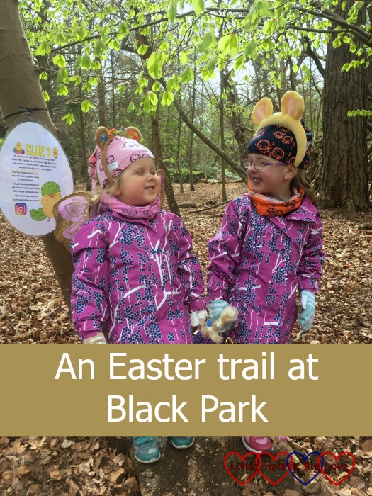 Jessica and Sophie pulling cheeky faces at each other at the Easter trail in Black Park.