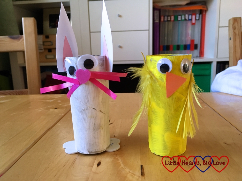 A rabbit and chick made from toilet rolls, cardboard and feathers