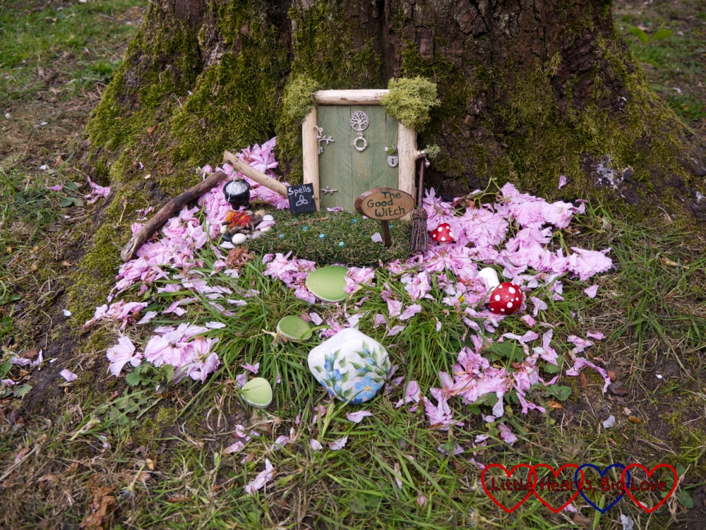 The good witch's door with a book of spells outside