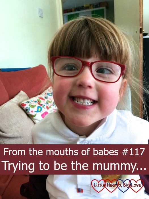 Jessica giving the camera a big grin - "From the mouths of babes #117 - Trying to be the mummy..."