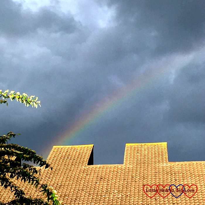 A rainbow above the buildings near our house