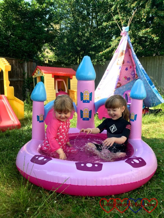 Jessica and Sophie splashing about in the paddling pool