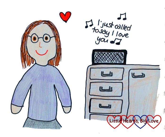 A drawing of me standing in the kitchen with the Sonos playing "I just called to say I love you"