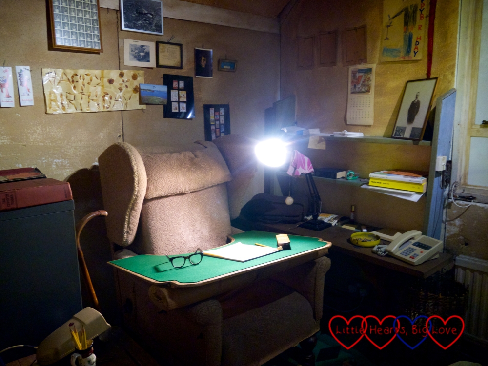 The inside of Roald Dahl's writing hut showing his writing chair