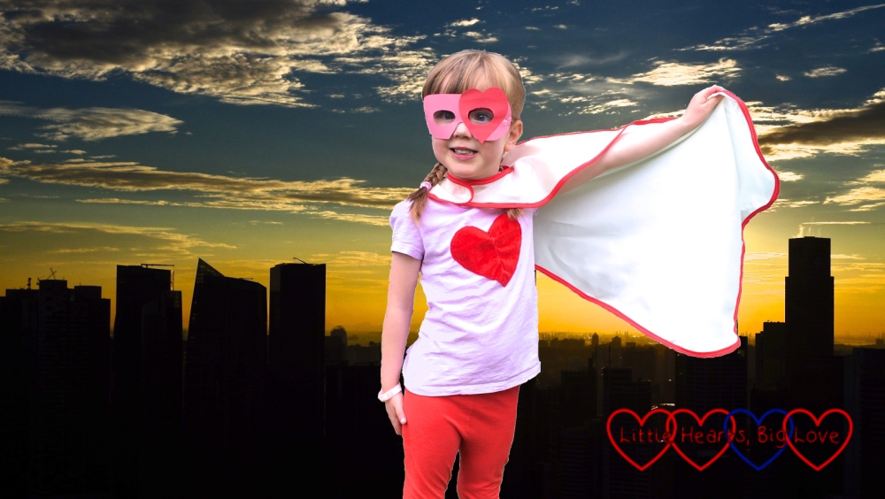 Super Jessica - Jessica in a superhero costume and mask against a night time city skyline