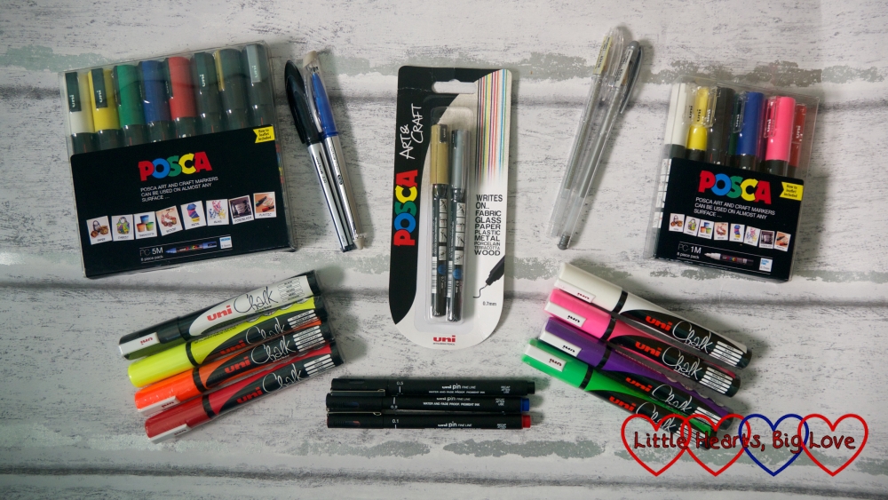 A selection of pens from the Uni-ball range - including POSCA markers, Uni Chalk markers, Uni PIN fine-line drawing pens, Signo gel pens, a Uni Air pen and a Signo TSI eraser pen