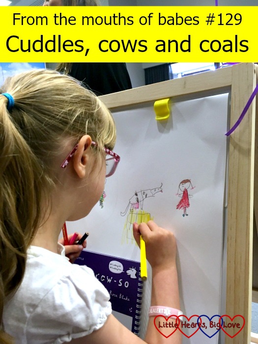 Jessica colouring in a picture of a cow - "From the mouths of babes #129 - Cuddles, cows and coals"