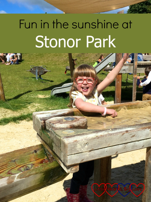 A very happy Jessica playing in the sand and water area at Stonor Park - "Fun in the sunshine at Stonor Park"