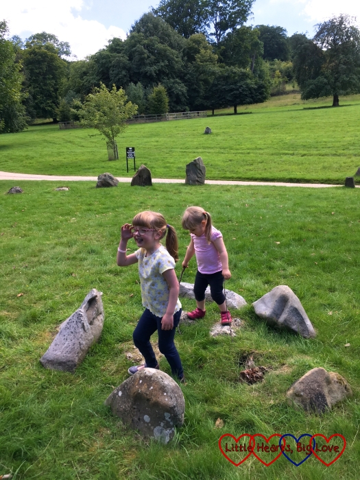 Sophie and Jessica exploring some of the stones in the stone circle at Stonor Park
