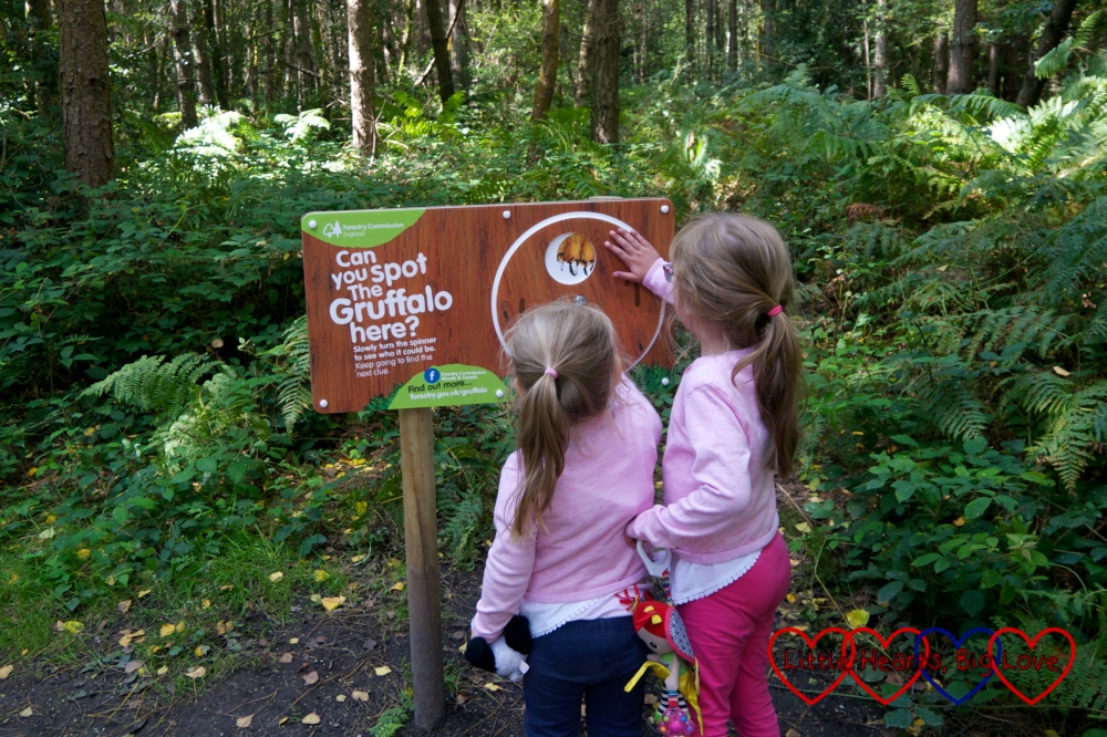Jessica and Sophie looking at one of the interactive clues on the Gruffalo Spotters trail at Alice Holt forest