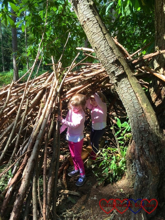 Jessica and Sophie exploring one of the dens at Alice Holt forest