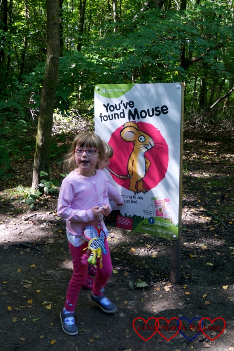 Jessica next to the "You've found Mouse" sign