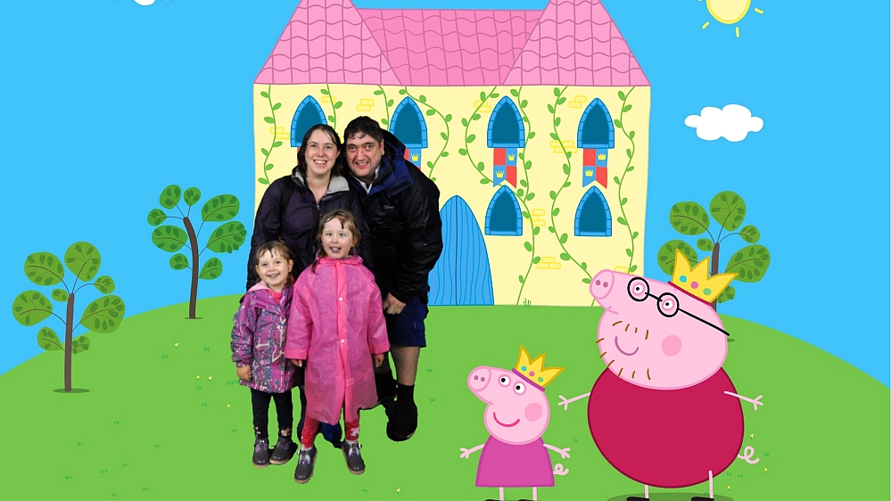 Me, hubby, Jessica and Sophie against a Peppa Pig castle backdrop with Princess Peppa and King Daddy Pig