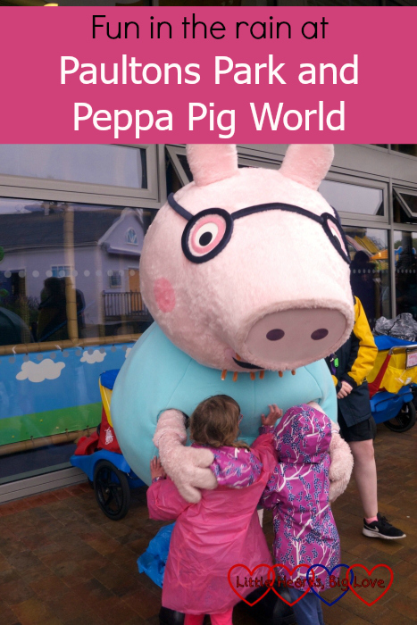 Jessica and Sophie giving Daddy Pig a hug at Peppa Pig World - "Fun in the rain at Paultons Park and Peppa Pig World"