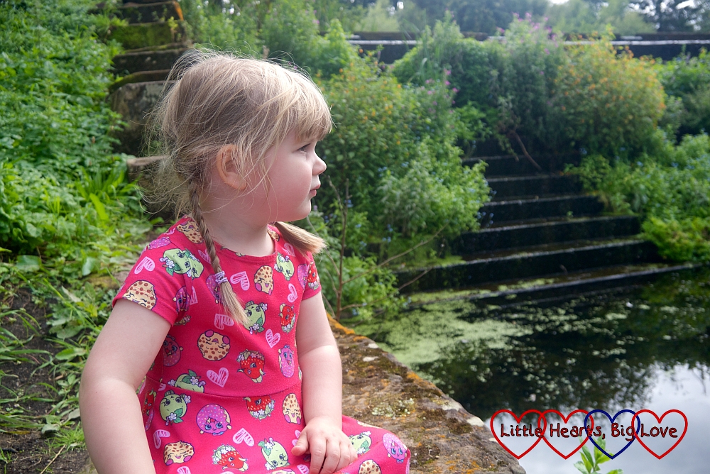 Sophie looking pensive while sitting near the cascade at Trentham Gardens