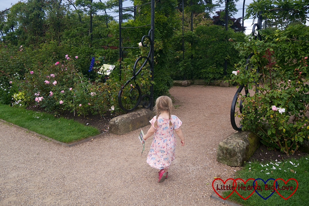 Sophie at the entrance to the trellis walk at Trentham Gardens
