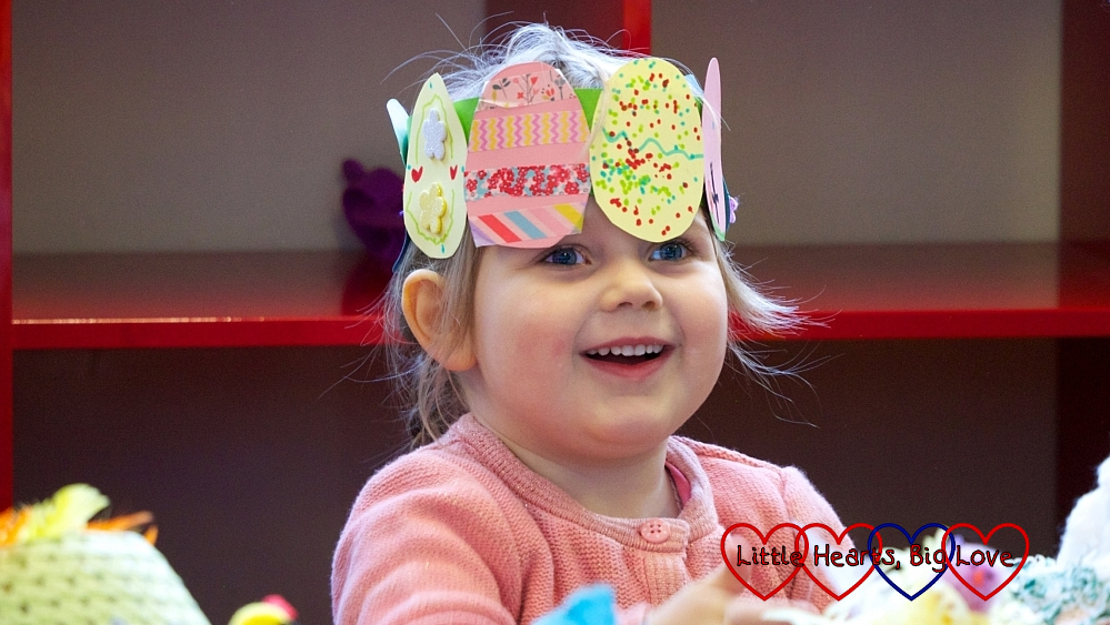 Sophie wearing her Easter egg crown in her preschool Easter concert