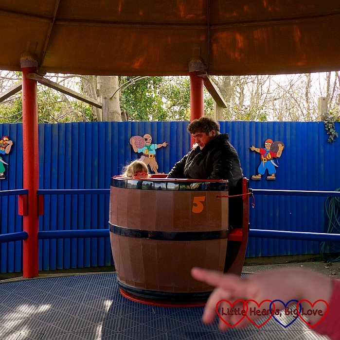 Jessica and Daddy on the Pirate Barrels ride