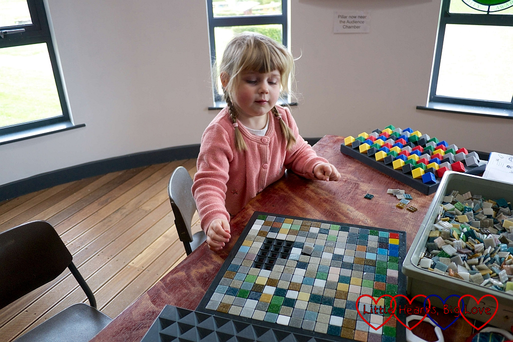 Sophie making her mosaic tile