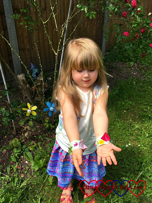 Sophie showing off her finished nature bracelets