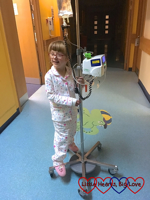 Jessica riding her IV pole in the hospital