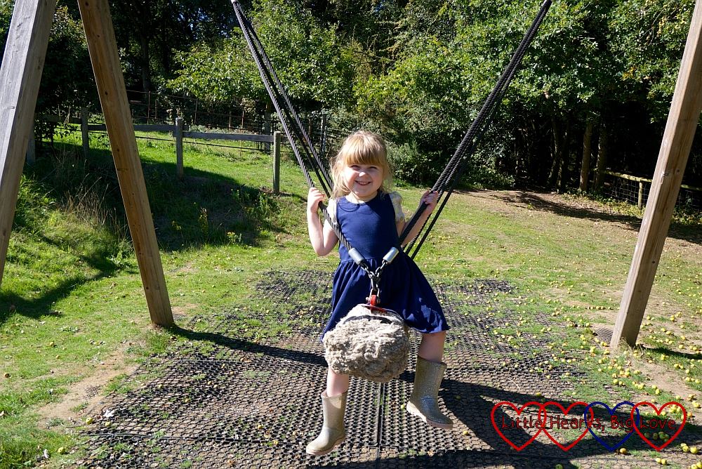 Sophie swinging on the rope swing