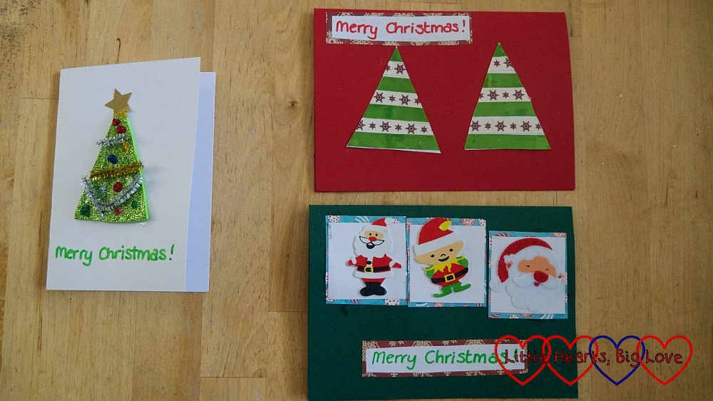 A sparkly craft foam Christmas tree card; a ribbon Christmas tree card and a card with festive stickers on
