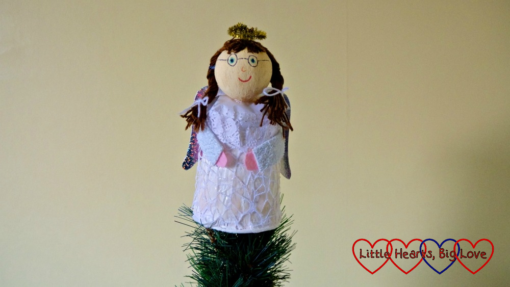 Our Jessica angel made from a polystyrene ball and paper cup on top of a Christmas tree