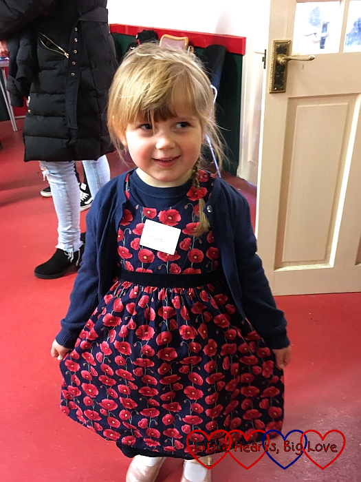 Sophie wearing a poppy print dress