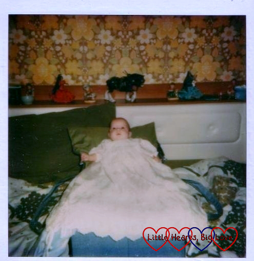 Me wearing my dad's christening gown