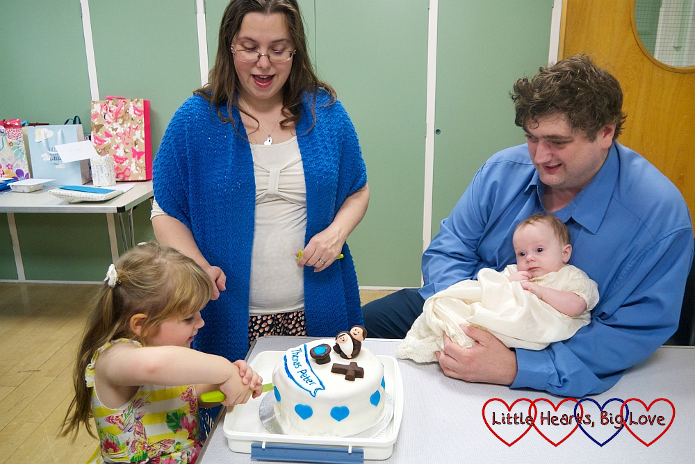 Sophie cutting Thomas's cake with me next to her and hubby holding Thomas