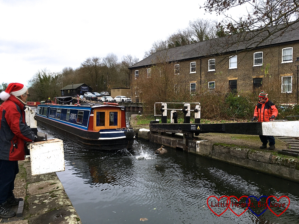 The narrowboat coming through the lock