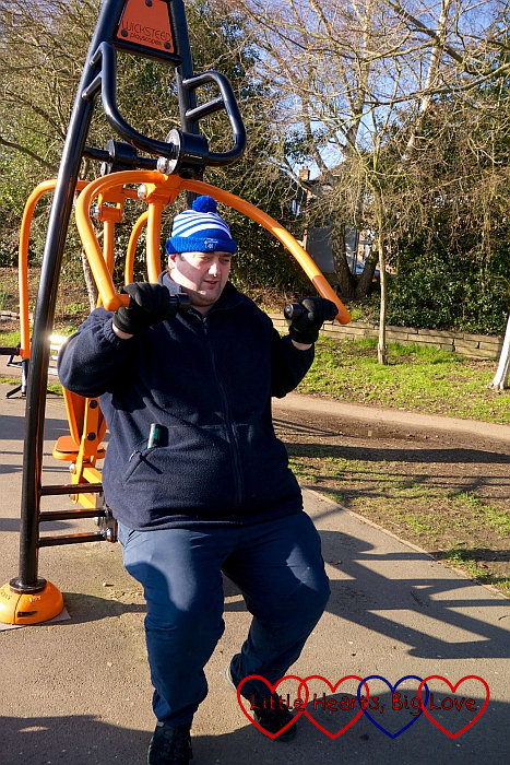 Hubby using the outdoor gym equipment
