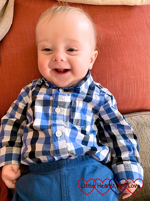 A smiley Thomas wearing a checked shirt