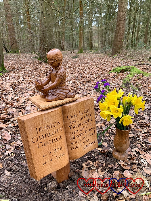 Jessica's memorial at GreenAcres, next to a wooden vase filled with daffodils