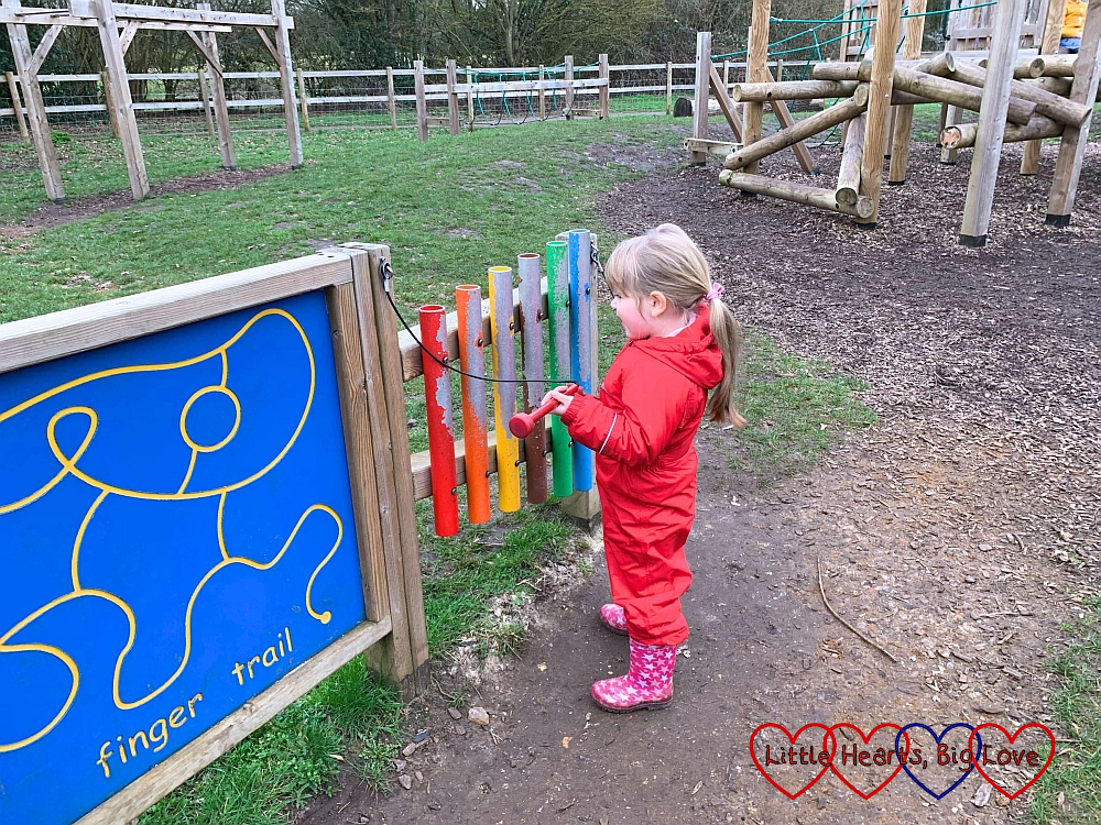 Sophie playing the xylophone in the children’s play area