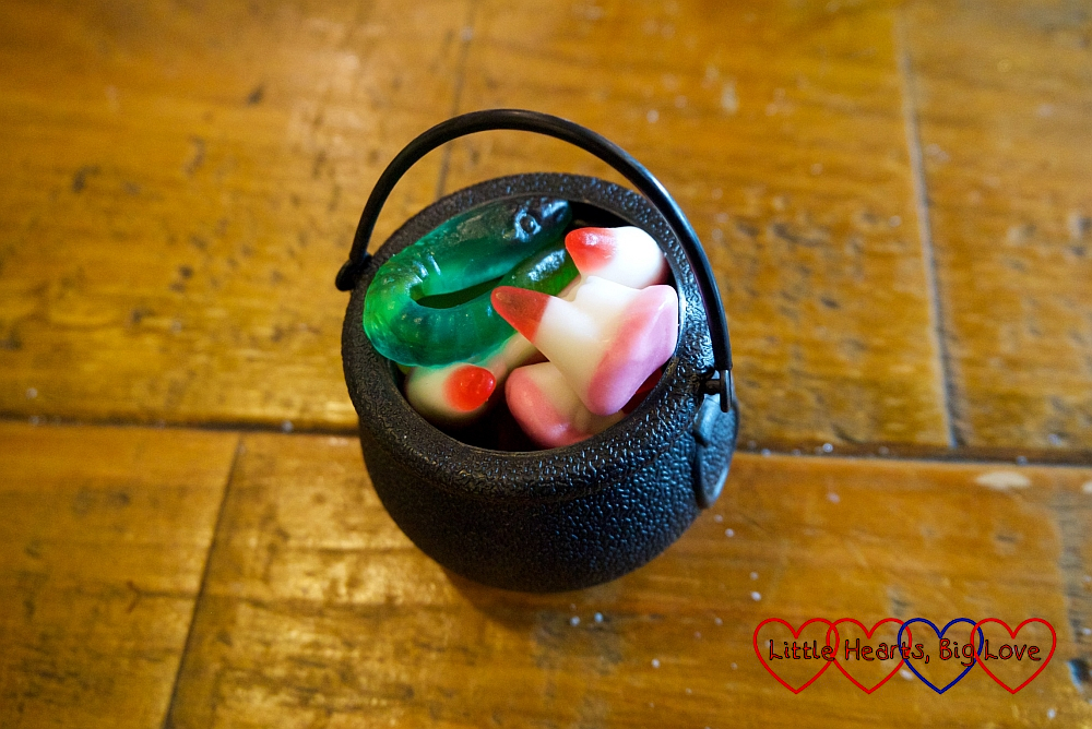 A mini cauldron filled with sweets