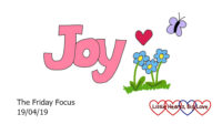 The word 'joy' with flowers, a heart and a butterfly