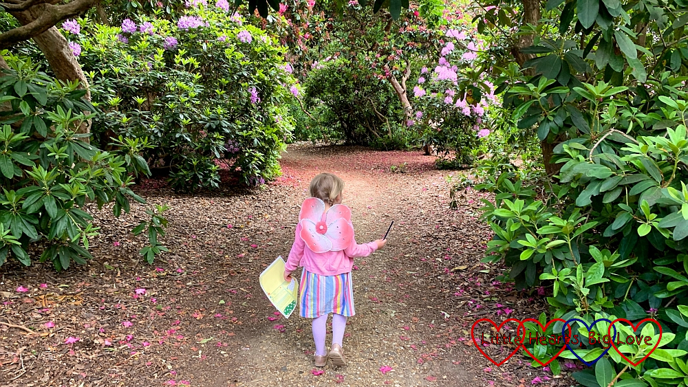 Sophie wearing fairy wings and walking through the Temple Gardens at Langley Park