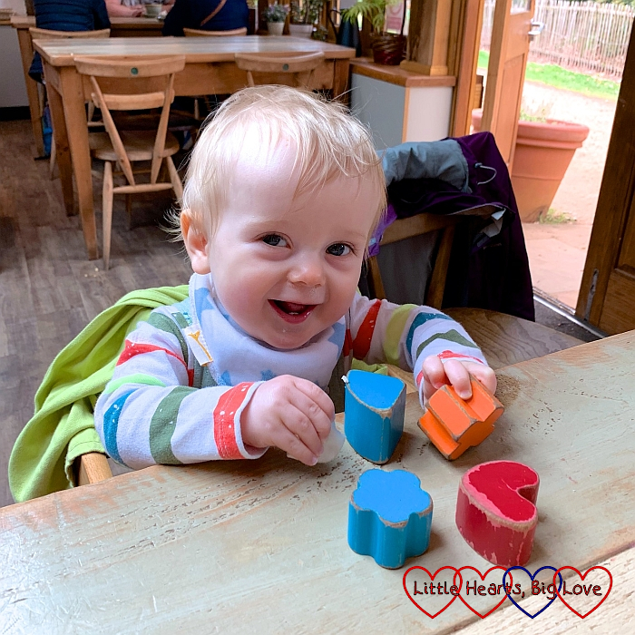 Thomas playing with bricks in the cafe at Langley Park