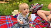 Thomas the day before his first birthday sitting and having a picnic