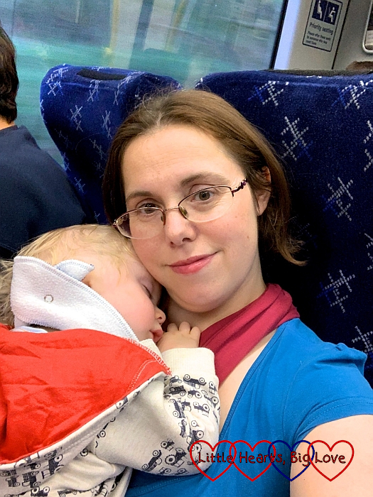 Me snuggling a sleeping Thomas on the train