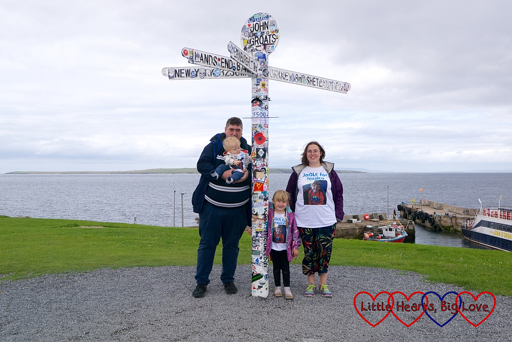Hubby, Thomas, Sophie and me (wearing our JoGLE for Jessica T-shirts) at the John O'Groats signpost