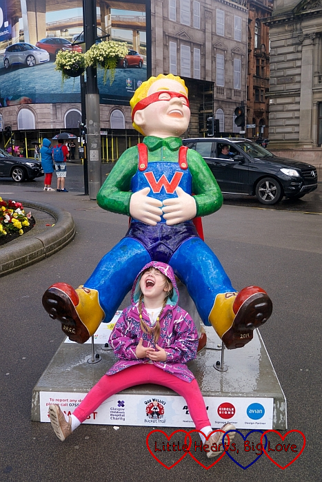 Sophie with the 'Wonder Wullie' Oor Wullie sculpture and copying the pose