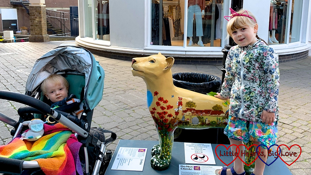 Sophie and Thomas with the 'Simba' lion sculpture in Windsor