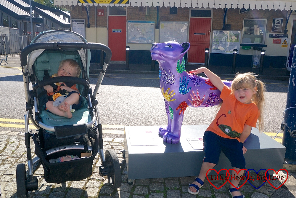 Sophie and Thomas with the 'Roary' lion sculpture outside Ascot railway station